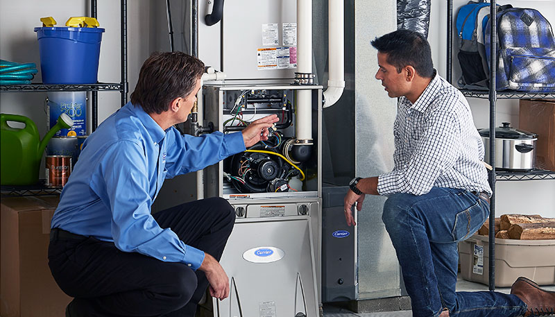 HVAC technician evaluating a furnace for repair or replacement in Surprise