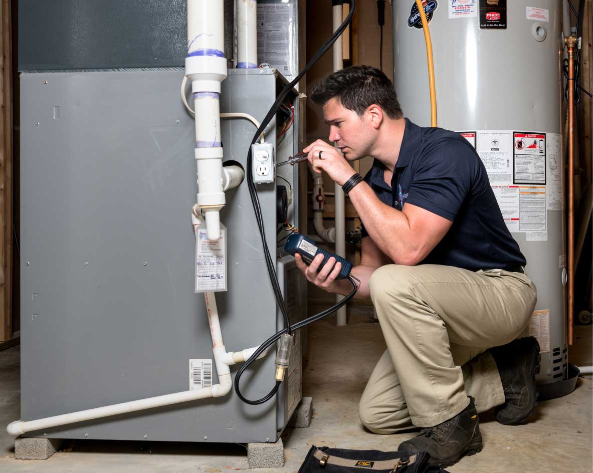 HVAC technician performing a furnace tune-up in Surprise