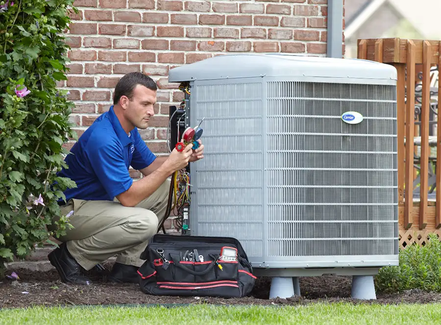 HVAC technician inspecting an outdoor air conditioning unit in Surprise